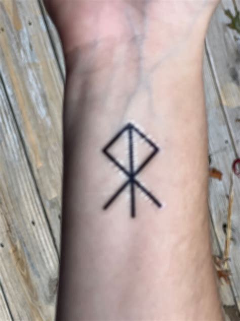 Othala rune tattoo representation